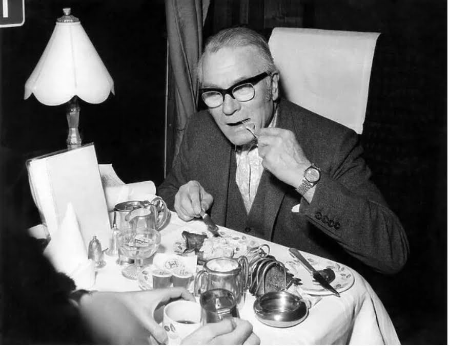 Daily Mirror photograph of Laurence Olivier eating scrambled eggs on the Pullman Car of the Brighton Belle